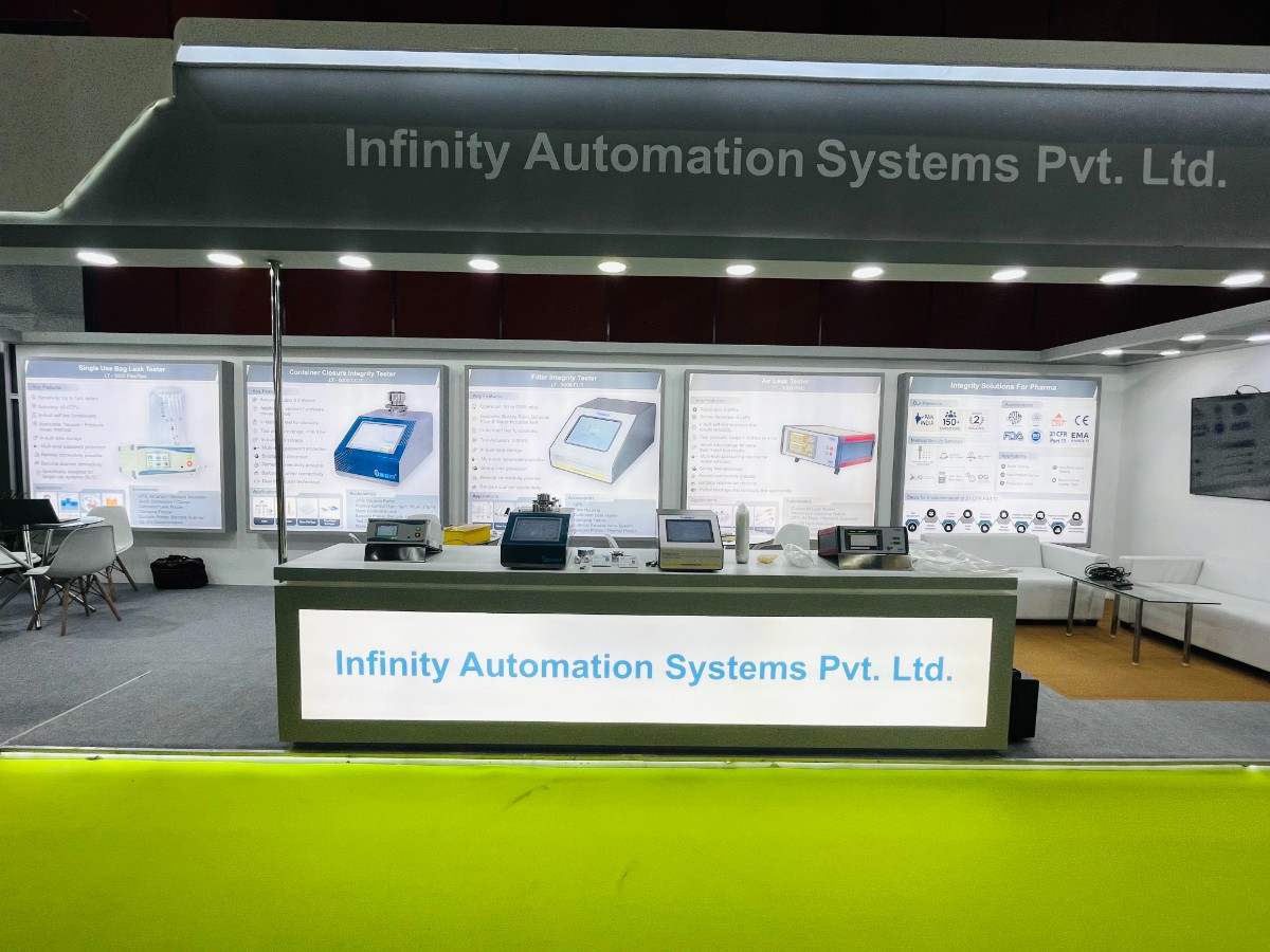 Infinity Automation Systems exhibition stall displaying testing equipment at Analytica Lab India 2026 Hyderabad